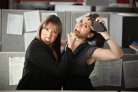 strangle women - Two female office workers fight in a cubicle Stock Photo - Budget Royalty-Free & Subscription, Code: 400-04405073