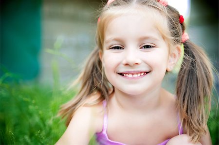 simsearch:400-05342069,k - cute little girl smiling in a park close-up Stock Photo - Budget Royalty-Free & Subscription, Code: 400-04405190