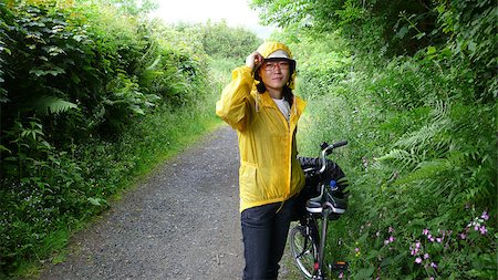 Woman in holidays cycling around Cornwall and Devon Stockbilder - Microstock & Abonnement, Bildnummer: 400-04405511