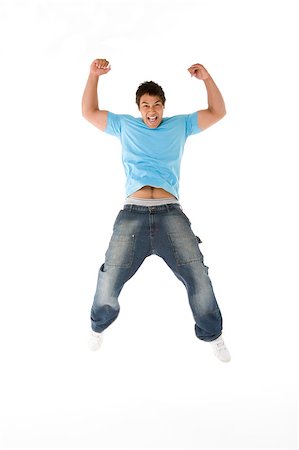 simsearch:400-04405553,k - Teenage Boy Jumping In The Air Stock Photo - Budget Royalty-Free & Subscription, Code: 400-04405543