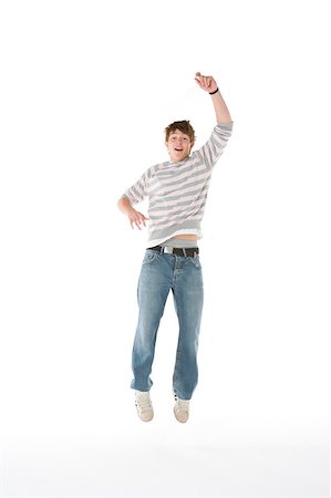 simsearch:400-04405553,k - Teenage Boy Jumping In The Air Stock Photo - Budget Royalty-Free & Subscription, Code: 400-04405550