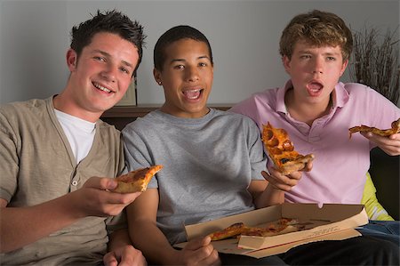 Teenage Boys Enjoying Pizza Stock Photo - Budget Royalty-Free & Subscription, Code: 400-04405745