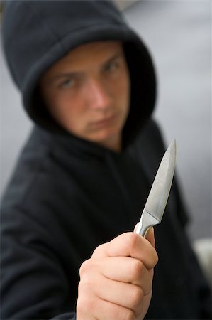 simsearch:400-05729571,k - Teenage Boy Branding Knife Stock Photo - Budget Royalty-Free & Subscription, Code: 400-04405818