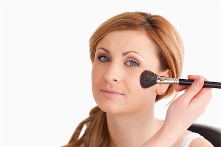 simsearch:400-04821060,k - Make-up artist applying make up to an attractive blond-haired woman in a studio Photographie de stock - Aubaine LD & Abonnement, Code: 400-04405844