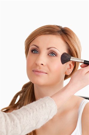 simsearch:400-04736335,k - Make-up artist applying make up to an attractive woman in a studio Photographie de stock - Aubaine LD & Abonnement, Code: 400-04405845