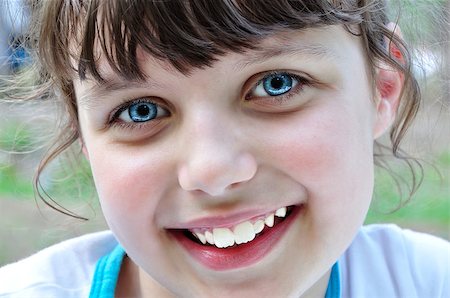 reverie - Portrait of a beautiful smiling young girl in the park (forest). Stock Photo - Budget Royalty-Free & Subscription, Code: 400-04405864