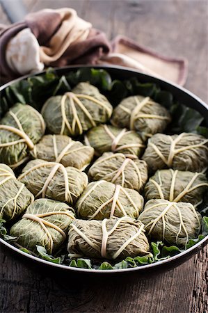 simsearch:400-04055000,k - Rustic food, armenian or greek dolmades wrapped with rhubarb leaves, meat and rice Photographie de stock - Aubaine LD & Abonnement, Code: 400-04406638