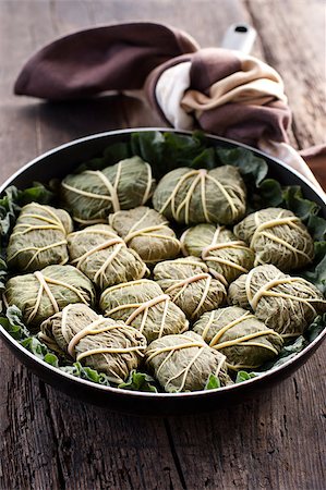 simsearch:400-04055000,k - Rustic food, armenian or greek dolmades wrapped with rhubarb leaves, meat and rice Photographie de stock - Aubaine LD & Abonnement, Code: 400-04406645