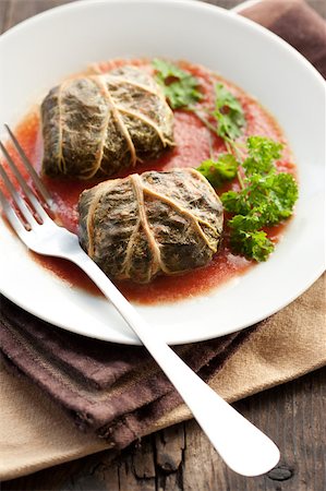 simsearch:400-04055000,k - Rustic food, armenian or greek dolmades wrapped with rhubarb leaves, meat and rice Photographie de stock - Aubaine LD & Abonnement, Code: 400-04406647