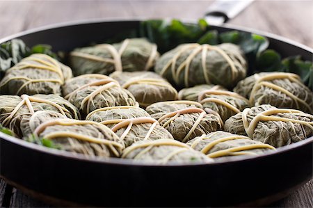 simsearch:400-04055000,k - Rustic food, armenian or greek dolmades wrapped with rhubarb leaves, meat and rice Photographie de stock - Aubaine LD & Abonnement, Code: 400-04406640