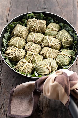 simsearch:400-04055000,k - Rustic food, armenian or greek dolmades wrapped with rhubarb leaves, meat and rice Photographie de stock - Aubaine LD & Abonnement, Code: 400-04406641