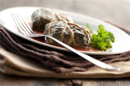 simsearch:400-04055000,k - Rustic food, armenian or greek dolmades wrapped with rhubarb leaves, meat and rice Photographie de stock - Aubaine LD & Abonnement, Code: 400-04406651