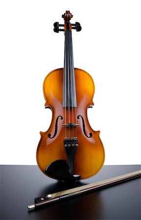 Violin on top of dark table partially isolated on white background. Stock Photo - Budget Royalty-Free & Subscription, Code: 400-04407470