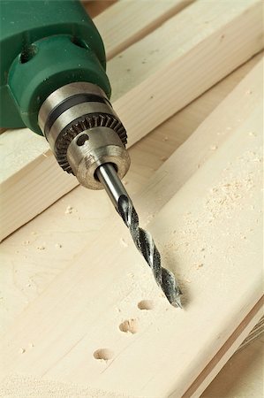 drilling (activity) - Drilling hole in a wooden plank. Photographie de stock - Aubaine LD & Abonnement, Code: 400-04407854