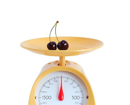 scales market fruits - Cherry lying on yellow kitchen scale. Isolated on white background with clipping path Stock Photo - Budget Royalty-Free & Subscription, Code: 400-04408685