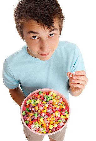 A boy holding a bowl of yummy coated popcorn. Stock Photo - Budget Royalty-Free & Subscription, Code: 400-04408772