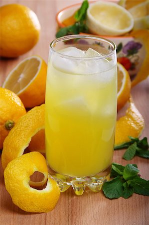 Lemonade from fresh lemons, ice and mint on a wooden table. Stock Photo - Budget Royalty-Free & Subscription, Code: 400-04408875