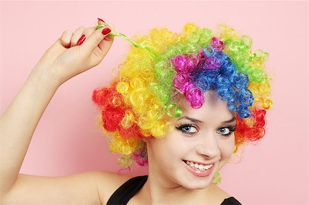 funny wig woman - Young beautiful woman in the wig of the clown Stock Photo - Budget Royalty-Free & Subscription, Code: 400-04408991