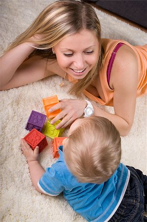 simsearch:400-04467628,k - Young mother playing with baby boy ( 1 year old ) at home. Photographie de stock - Aubaine LD & Abonnement, Code: 400-04409235
