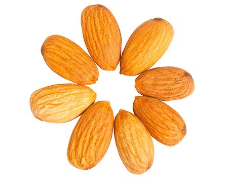 simsearch:400-04173906,k - Almond nuts out on a circle isolated on white background. Top view Stock Photo - Budget Royalty-Free & Subscription, Code: 400-04409537