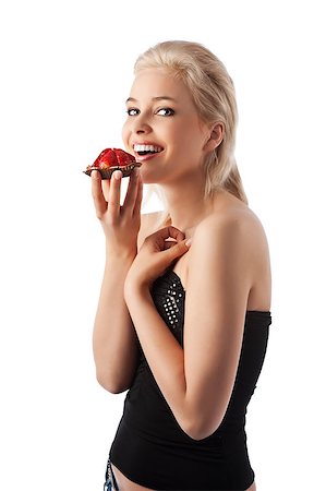 Portrait of young smiling woman with sweets with blond hair and elegant dress isolated over white Foto de stock - Super Valor sin royalties y Suscripción, Código: 400-04409877