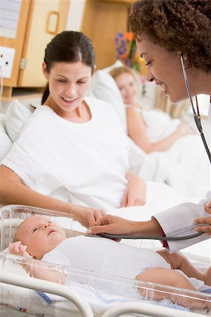 Doctor checking baby's heartbeat with new mother watching and sm Stock Photo - Budget Royalty-Free & Subscription, Code: 400-04400694