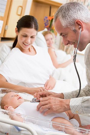 Doctor checking baby's heartbeat with new mother watching and sm Stock Photo - Budget Royalty-Free & Subscription, Code: 400-04400696