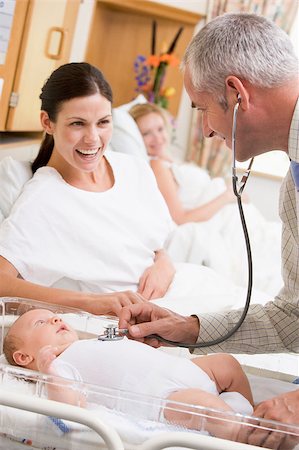 Doctor checking baby's heartbeat with new mother watching and sm Stock Photo - Budget Royalty-Free & Subscription, Code: 400-04400697