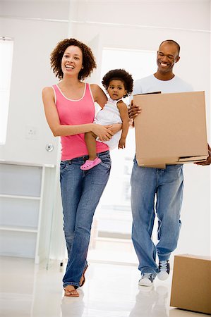 simsearch:400-08938320,k - Family moving into new home smiling Stock Photo - Budget Royalty-Free & Subscription, Code: 400-04400811