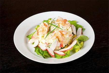 simsearch:400-05673047,k - Salad of shrimps, crab meat, cucumbers, apples, potatoes, lettuce, maize, eggs and mayonnaise Foto de stock - Royalty-Free Super Valor e Assinatura, Número: 400-04401244