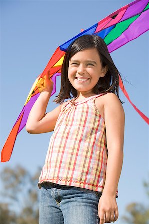 Young girl with kite outdoors smiling Stock Photo - Budget Royalty-Free & Subscription, Code: 400-04401912