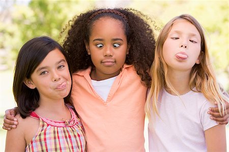 simsearch:400-04402106,k - Three young girl friends outdoors making funny faces Fotografie stock - Microstock e Abbonamento, Codice: 400-04402087