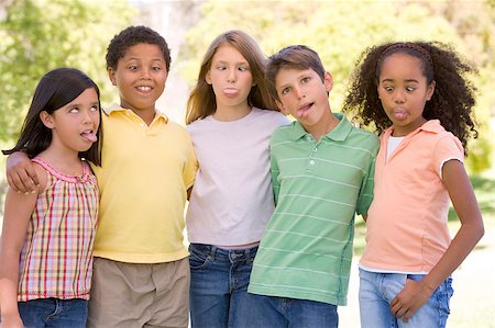 funny faces african american - Five young friends standing outdoors making funny faces Stock Photo - Budget Royalty-Free & Subscription, Code: 400-04402089