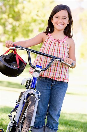 simsearch:400-04402100,k - Young girl with bicycle outdoors smiling Stock Photo - Budget Royalty-Free & Subscription, Code: 400-04402100