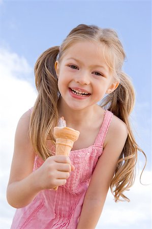 summer ice cream child - Young girl outdoors eating ice cream cone and smiling Stock Photo - Budget Royalty-Free & Subscription, Code: 400-04402120