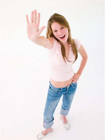 Teenage girl with hand up smiling Stock Photo - Budget Royalty-Free & Subscription, Code: 400-04402231