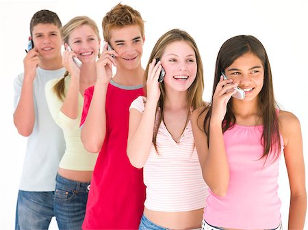 simsearch:400-04402293,k - Row of five friends on cellular phones smiling Stock Photo - Budget Royalty-Free & Subscription, Code: 400-04402295