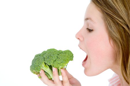 simsearch:400-04402341,k - Teenage girl eating broccoli Stock Photo - Budget Royalty-Free & Subscription, Code: 400-04402309