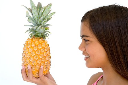 simsearch:400-04402342,k - Young girl holding pineapple and smiling Stock Photo - Budget Royalty-Free & Subscription, Code: 400-04402311