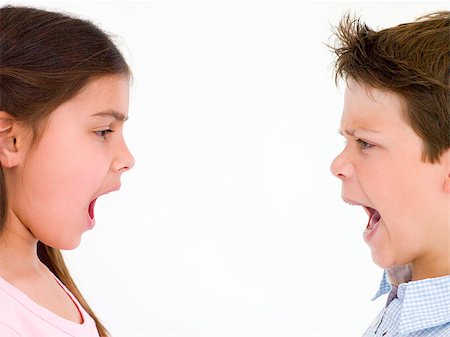 Brother and sister looking at each other shouting Stock Photo - Budget Royalty-Free & Subscription, Code: 400-04402330
