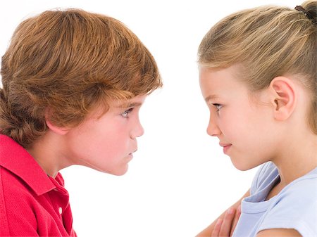 Brother and sister staring at each other Stock Photo - Budget Royalty-Free & Subscription, Code: 400-04402345