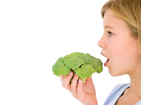 Young girl eating broccoli Stock Photo - Budget Royalty-Free & Subscription, Code: 400-04402340