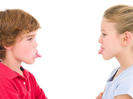 Brother and sister sticking tongues out at each other Stock Photo - Budget Royalty-Free & Subscription, Code: 400-04402343