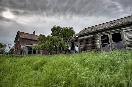 decrepit barns - Abandoned Farm with storm clouds in the Canadian Prairie Stock Photo - Budget Royalty-Free & Subscription, Code: 400-04402390