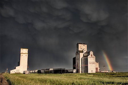 Prairie Grain Elevator in Saskatchewan Canada with storm clouds and rainbow Stock Photo - Budget Royalty-Free & Subscription, Code: 400-04402409