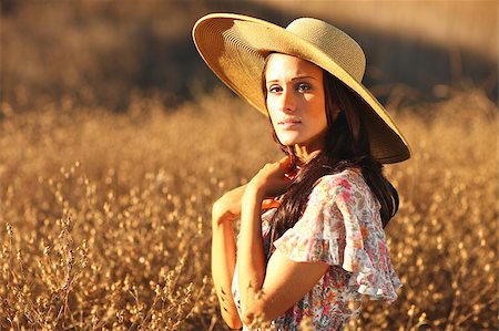 Beautiful Woman in a Field During Summer With Hat Stock Photo - Budget Royalty-Free & Subscription, Code: 400-04402431