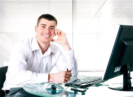 simsearch:400-05244427,k - Happy businessman sits at the computer on the office Stock Photo - Budget Royalty-Free & Subscription, Code: 400-04402494