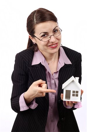 simsearch:625-02265924,k - Young woman holding  house model. Real estate concept Foto de stock - Super Valor sin royalties y Suscripción, Código: 400-04402574