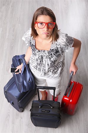 A picture of a young woman waiting with many pieces of luggage at the airport Stock Photo - Budget Royalty-Free & Subscription, Code: 400-04403019