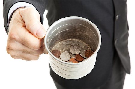 Closeup of a businessman with a tin cup, begging for change.  White background. Stock Photo - Budget Royalty-Free & Subscription, Code: 400-04414078